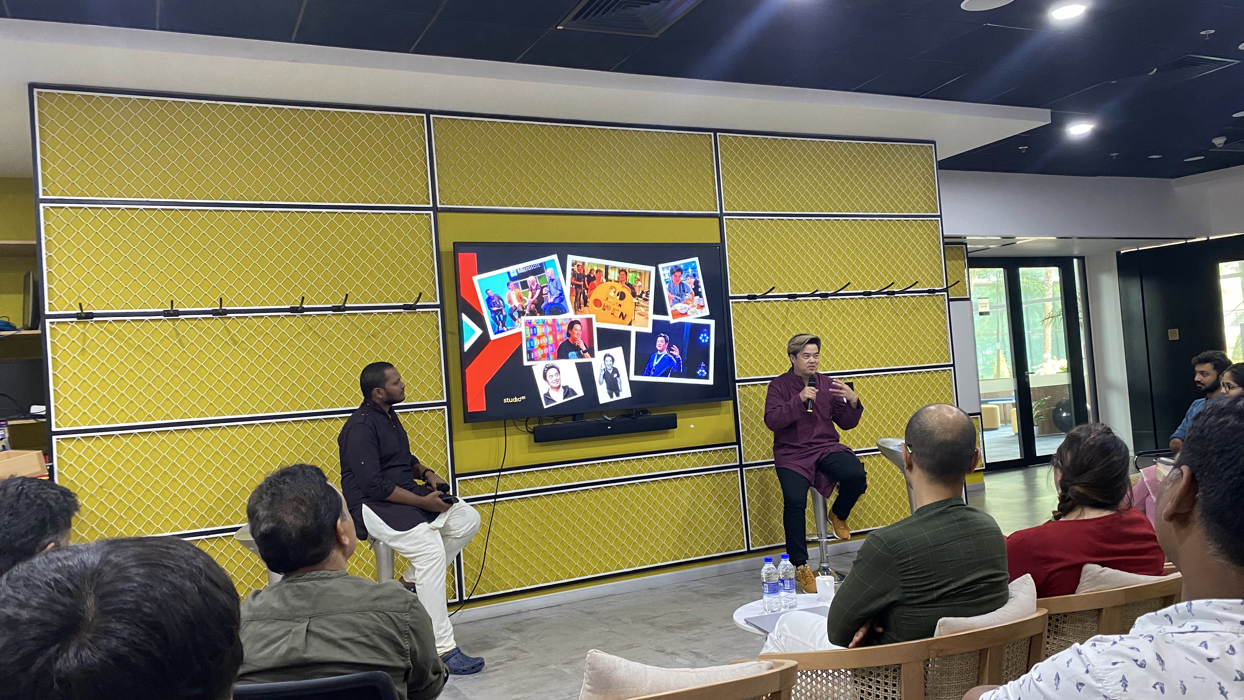 Tejj fireside chat with photo collage on screen